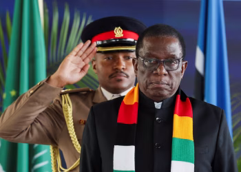 Zimbabwe's President Emmerson Mnangagwa, right, rose to the presidency in 2017 after a military coup.