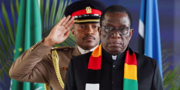 Zimbabwe's President Emmerson Mnangagwa, right, rose to the presidency in 2017 after a military coup.